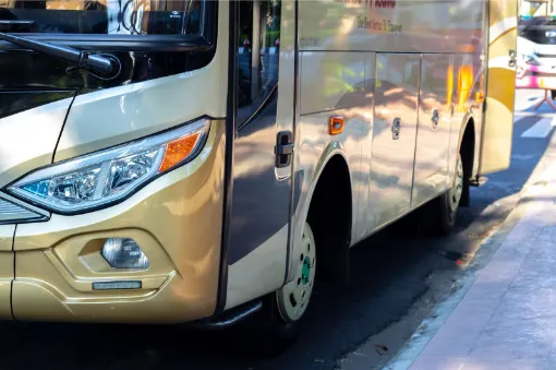 The bus goes on the road from the airport