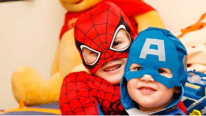 Children play and laugh in costumes