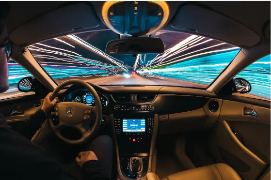 The driver is driving a car around the city